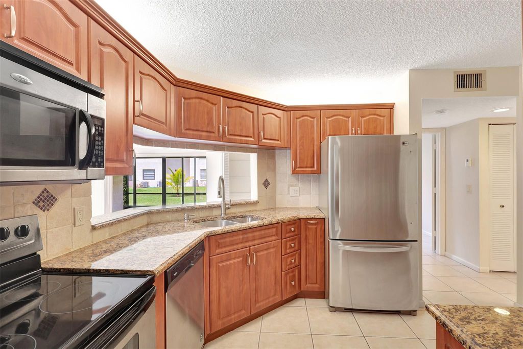 Photo of 23 Via De Casas Sur #103, Boynton Beach, FL 33426 (MLS # F10430297)