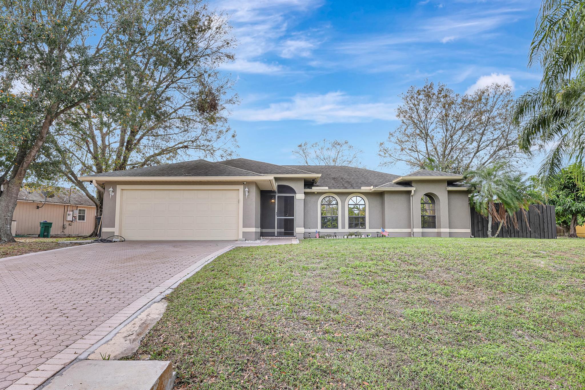 Welcome to your dream home in the heart of Port St. Lucie. spacious open layout with separate living, family and dining areas.The oversized, fully fenced yard also includes a shed, offering plenty of space for gatherings with family and friends. Minutes away from i 95 and Turnpike