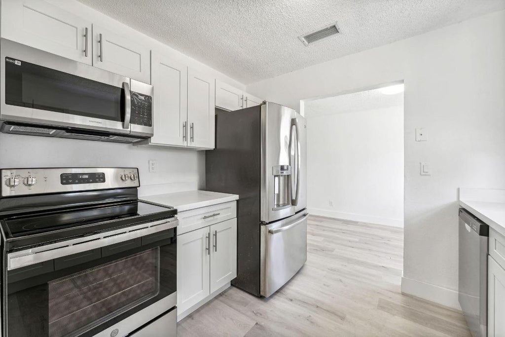 Photo of 514 NW 3rd Way, Deerfield Beach, FL 33441 (MLS # R10955111)