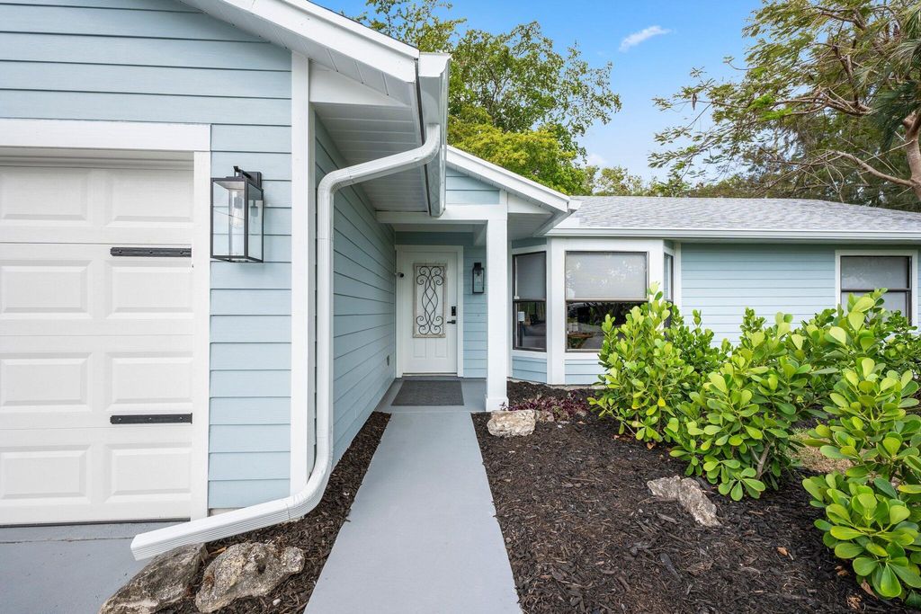 Photo of 411 SW Namoit Place, Port Saint Lucie, FL 34953 (MLS # R10986708)