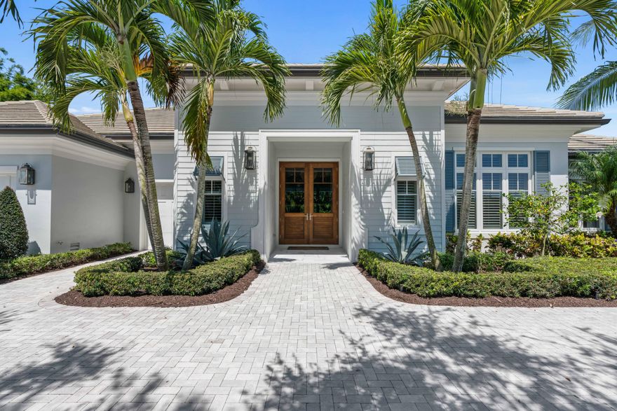 Nestled along the oak canopied streets of the Admirals Cove Golf Village lies this exquisite custom home, built by Maxwell Building and designed by Kara Miller Interiors. The construction quality of this home is second to none with CBS construction, icynene insulation, impact windows & doors, and a Generac whole-house generator.

Inside, it only gets better. The gourmet kitchen was built for a culinary chef with Jenn-Air appliances, natural gas cooktop and 2 working islands. The custom cabinetry was expertly crafted by European Custom, including paneled refrigerators, dishwasher, refrigerator, drawers, and wine storage. 

The millwork package is what separates this home from all the rest with solid wood paneled jams, window casings, crown moldings, and 7 1/2 inch baseboards. cont.... Additional millwork in the bedrooms & baths include nickel-joint paneling and drapery pockets. The porcelain tile flooring resembles white oak, was mud set and was imported from Italy.

The master suite features storefront, impact windows, a gracious sitting area, upgraded closet systems and tropical views of the gorgeous back yard. In the master bath, you will find a large shower with a frameless glass enclosure, contemporary freestanding tub, his & her vanities and water closets.

The guest suites are oversized and comfortable, all with ensuite baths, designer plumbing fixtures and custom millwork details. 

This Admirals Cove residence also features a large club room with storefront windows that bring the outside, inside. Custom Built-ins in the club room and living areas round out the luxury.

Outside is where the magic happens. Completely private with lush, tropical landscaping, but the backyard's focal point is the heated pool and spa. Scuppers cascade beautiful waterfalls into the pool and at night, the pool comes alive with fiber optic lighting in any color your choose. If swimming is not on the menu, relax in the afternoon by the natural gas fire pit with your favorite glass of red. If a cookout is in your future, you'll greatly enjoy the custom summer kitchen and all the outdoor living space that comes when owning this amazing home.

Admirals Cove features 45-holes of golf, a tennis club, state of the art fitness, 7 gourmet restaurants, 54-slip floating dock marina, world class, salon & spa and so much more. You have found paradise in the heart of Jupiter, Florida.