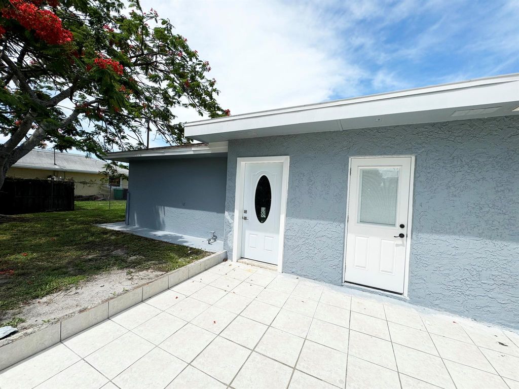 Photo of 702 NE Lanfair Street NE #B, Port Saint Lucie, FL 34983 (MLS # R10998802)