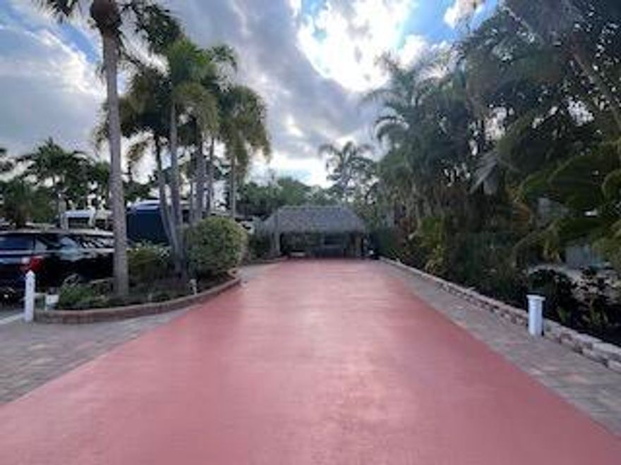 Beautiful landscaped . Large granite bar for wonderful outdoor entertainment Newer large tiki, close to pool and additional parking. close to laundry facilities. Very active community . Bocce ball , shuffleboard, pickle ball , tennis , 18 hole golf course. This lot backs onto the reserve for privacy and has mature, lush landscaping. Newly refinished with more contemporary pavers, a golf cart parking area, and refreshed built in kitchen that includes a JennAir grill. Most of the furniture and storage units remain. There is a mosquito spraying system to ensure enjoyable evenings in the tiki. Private lot that's back to preserve.