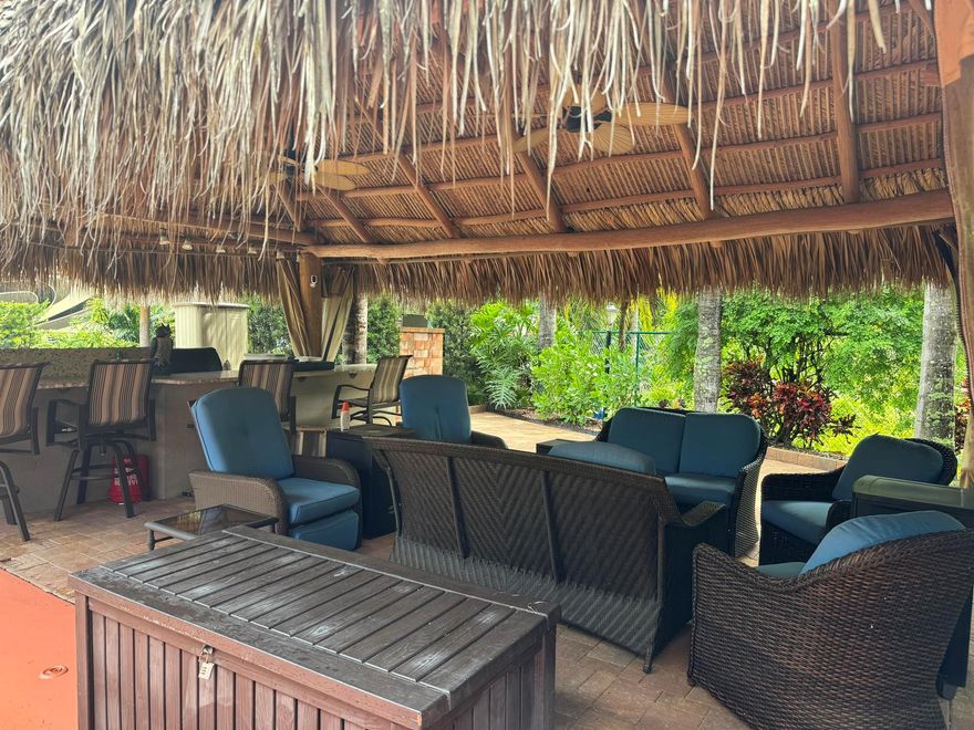 Beautiful landscaped . Large granite bar for wonderful outdoor entertainment Newer large tiki, close to pool and additional parking. close to laundry facilities. Very active community . Bocce ball , shuffleboard, pickle ball , tennis , 18 hole golf course. This lot backs onto the reserve for privacy and has mature, lush landscaping. Newly refinished with more contemporary pavers, a golf cart parking area, and refreshed built in kitchen that includes a JennAir grill. Most of the furniture and storage units remain. There is a mosquito spraying system to ensure enjoyable evenings in the tiki. Private lot that's back to preserve.