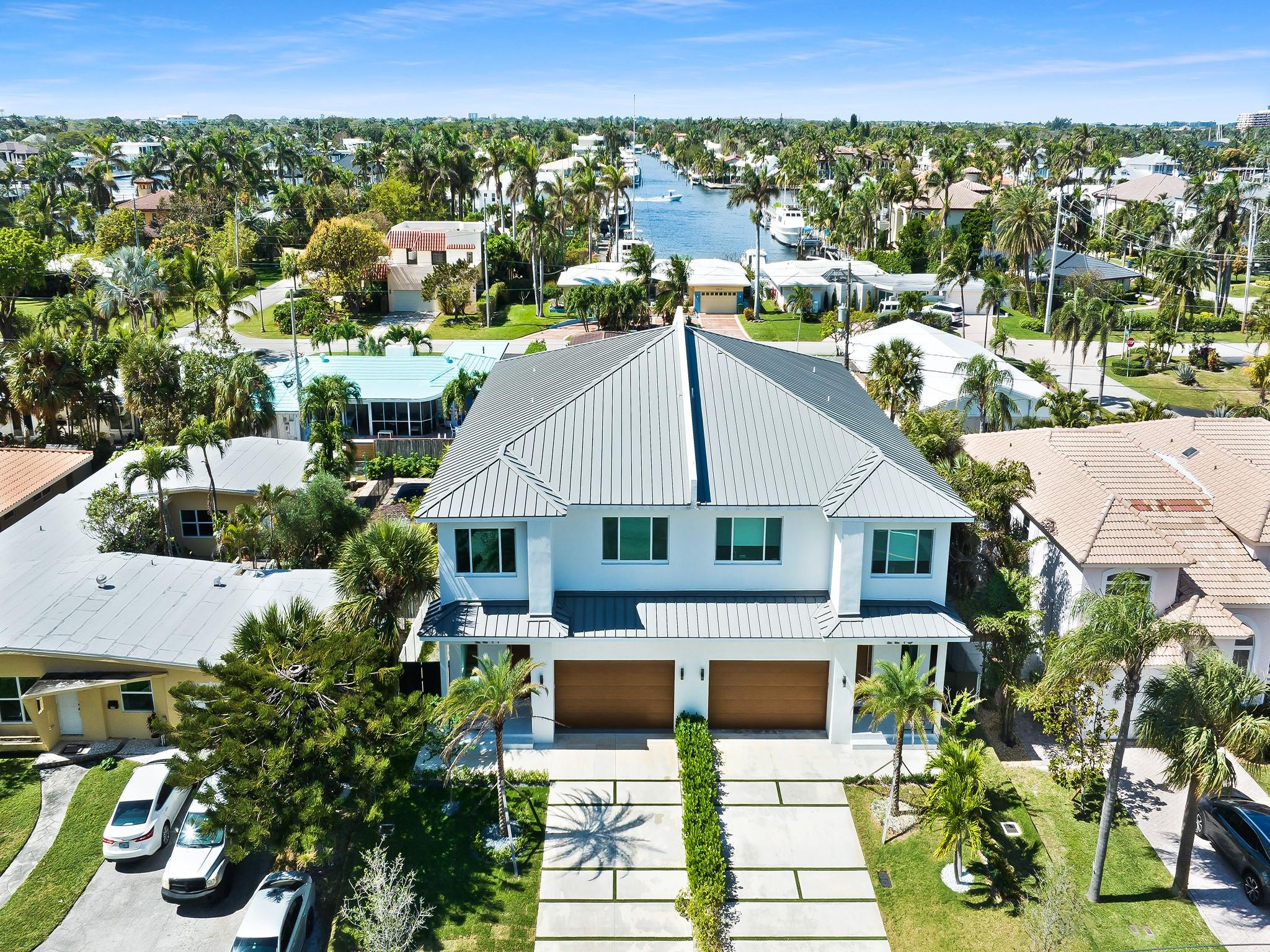 BRAND NEW CONSTRUCTION! 2 story fee simple luxury Townhome just a 3 minute walk to the beach! Approximately 3300 SF that offers 4 bedrooms, 4 baths, heated saltwater pool and 2 car garage! Top of the line appliances include Sub Zero and Wolf appliances, large island with quartz countertops and custom Italian cabinetry. Great room floor plan on 1st floor. All bedrooms on 2nd floor. Gorgeous wide planked hardwood floors throughout and custom staircase leading to the second floor. Impact windows and doors, metal roof! Walk outside to the pool area and custom summer kitchen with waterfall pool. Pocket doors open up all the way to experience the South Florida lifestyle! No HOA fees! Pleasure to show!