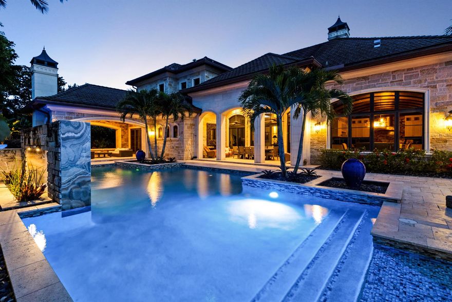 Welcome to one of the LARGEST & most extraordinary homes in Coral Springs. Situated on .75 acres in the exclusive, gated Maplewood Isle community, this 6-bed, 5 full & 4 half-bath estate was meticulously rebuilt in 2010. Enjoy luxurious living with 16ft ceilings, a grand primary suite w/ spa like en suite, MOVIE THEATER, bar, and an XLG office/study. The home features IMPACT WINDOWS & DOORS, a pool & hot tub the Ritz would envy, a summer kitchen, & a newly resurfaced private tennis court. Gourmet chefs will appreciate the Sub-Zero Refrigerator & Wolf Gas Range . The professional landscaping and Venetian plaster walls add a touch of elegance seldomly seen. With 104 homes in the community & only 5 boast such an expansive double lot this is a rare opportunity you will not want to miss.