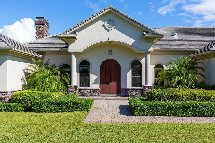 ﻿Imagine yourself in the premier gated equestrian community of Palm Beach Point with bridle path access to the Palm Beach International Equestrian Center and Global Dressage. This gorgeous stacked stone 4 bedroom/4 bathroom home has been impeccably renovated and features 4,559 square feet of expansive living and entertaining space. Delight your senses in the luxurious kitchen with Thermador appliances, shaker cabinets, and a waterfall t-shaped island with room for additional seating. This upgraded home presents incredible details with marble and wood flooring, a dry bar with wine fridge, mud room cabinetry, new bathroom vanities with quartz & granite countertops, a gas fireplace with built in shelving, new cabinets with quartz countertops and folding station in the laundry room.