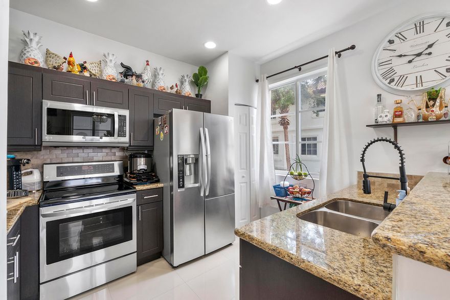 Move-in ready and beautifully maintained, this 3-bedroom, 2.5-bath multi-level townhouse is located in the highly desirable Boardwalk at Vizcaya community and is perfect for both owner-occupants and savvy investors. Filled with natural light, the home features an open-concept living area, granite countertops, stainless steel appliances, bar seating, and a spacious pantry. The primary suite offers a walk-in closet, double vanity, frameless glass shower and separate soaking tub. Major upgrades include a NEW ROOF (2025)  IMPACT WINDOWS, and NEW A/C (2024) Fannie Mae approved condo! Residents enjoy resort-style amenities including a clubhouse, pool area with lounge seating, gym, pet grooming station, & lush landscaping! Centrally located near Flamingo Rd and Miramar Town Center.