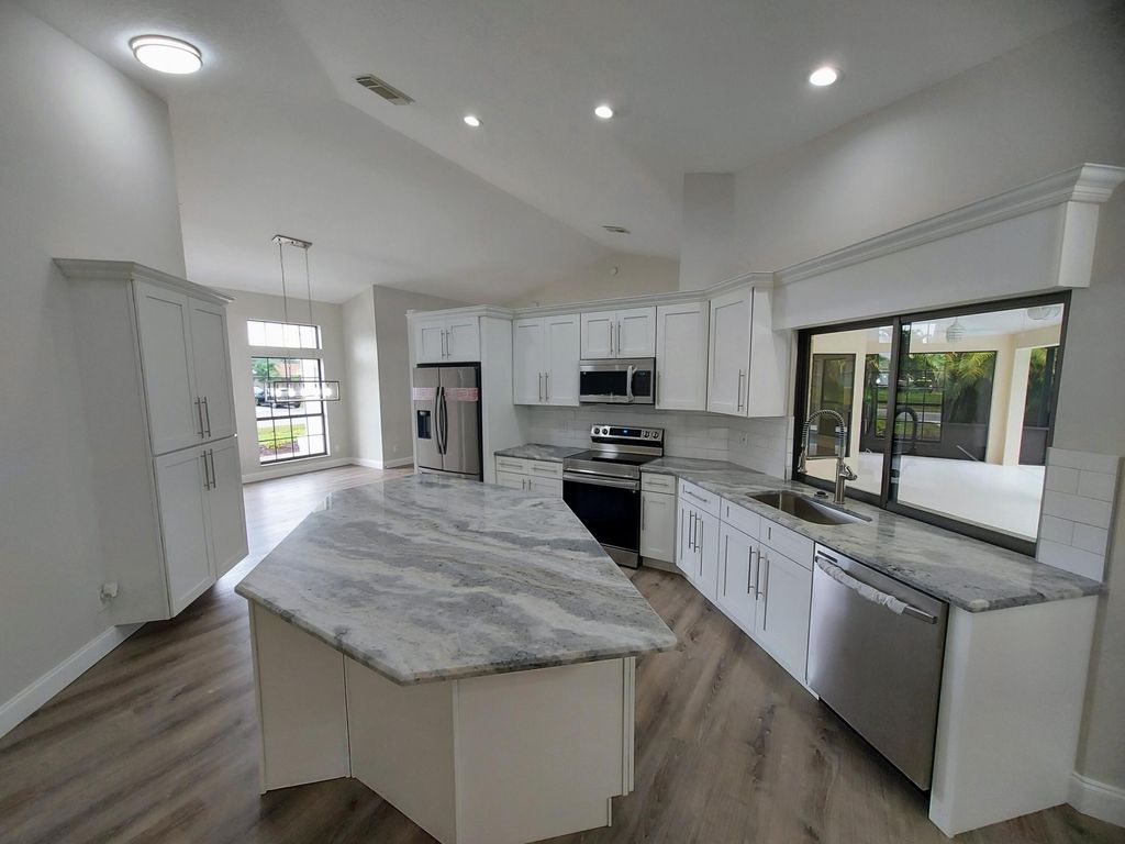 Photo of 2111 SE Bowie Street, Port Saint Lucie, FL 34952 (MLS # R10956656)