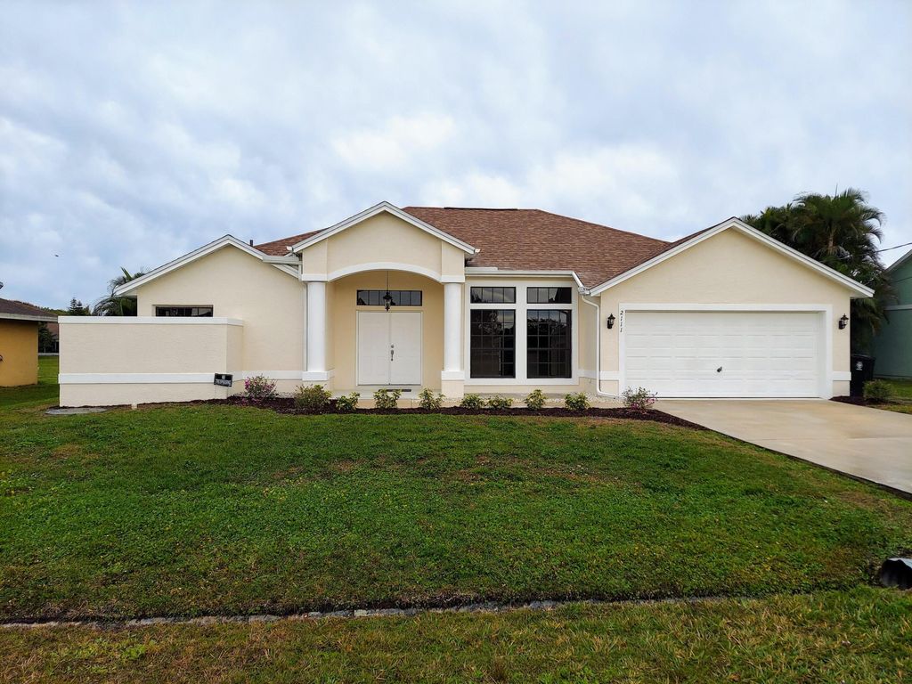 Photo of 2111 SE Bowie Street, Port Saint Lucie, FL 34952 (MLS # R10956656)