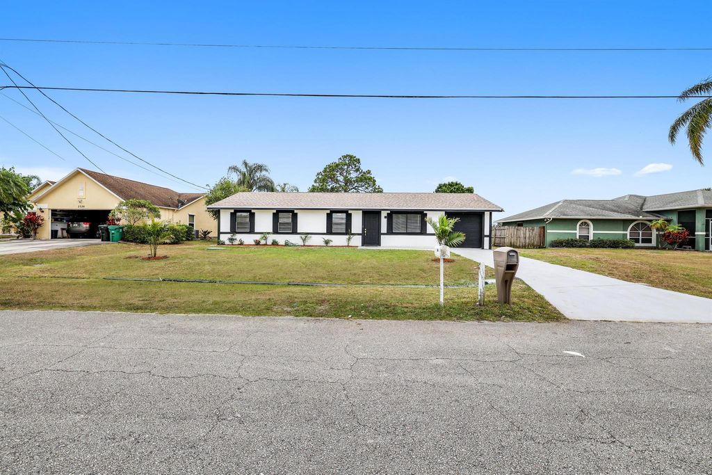 Photo of 2320 SE Harrington Avenue, Port Saint Lucie, FL 34952 (MLS # R10980889)