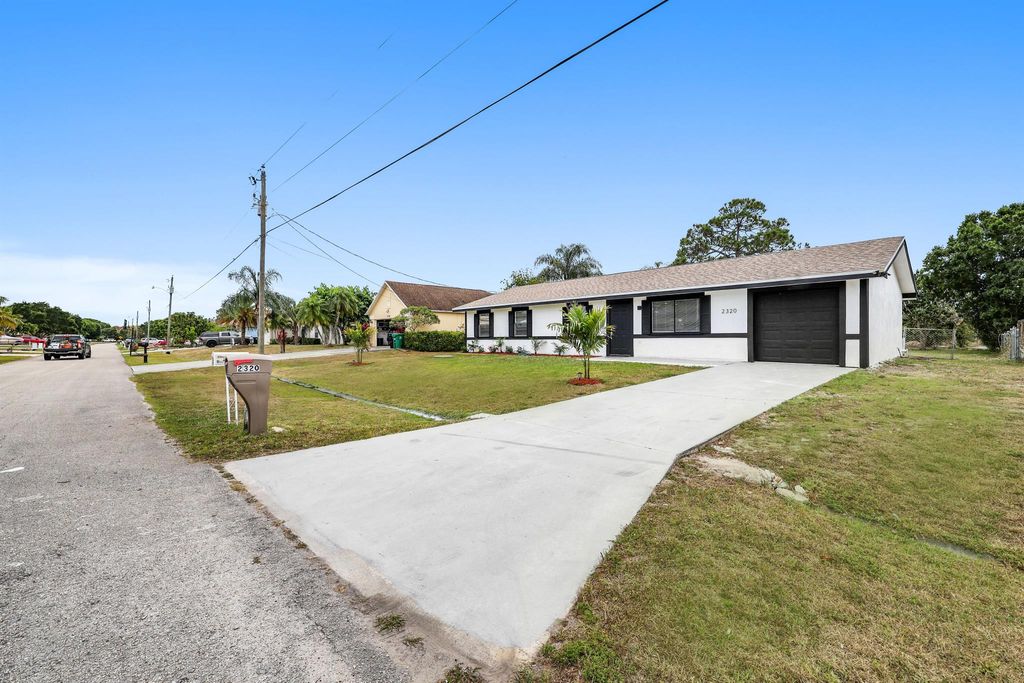 Photo of 2320 SE Harrington Avenue, Port Saint Lucie, FL 34952 (MLS # R10980889)