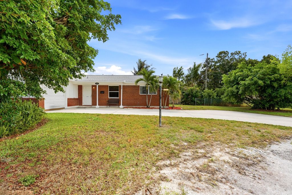 Photo of 1509 W Road, West Palm Beach, FL 33403 (MLS # B26007068)