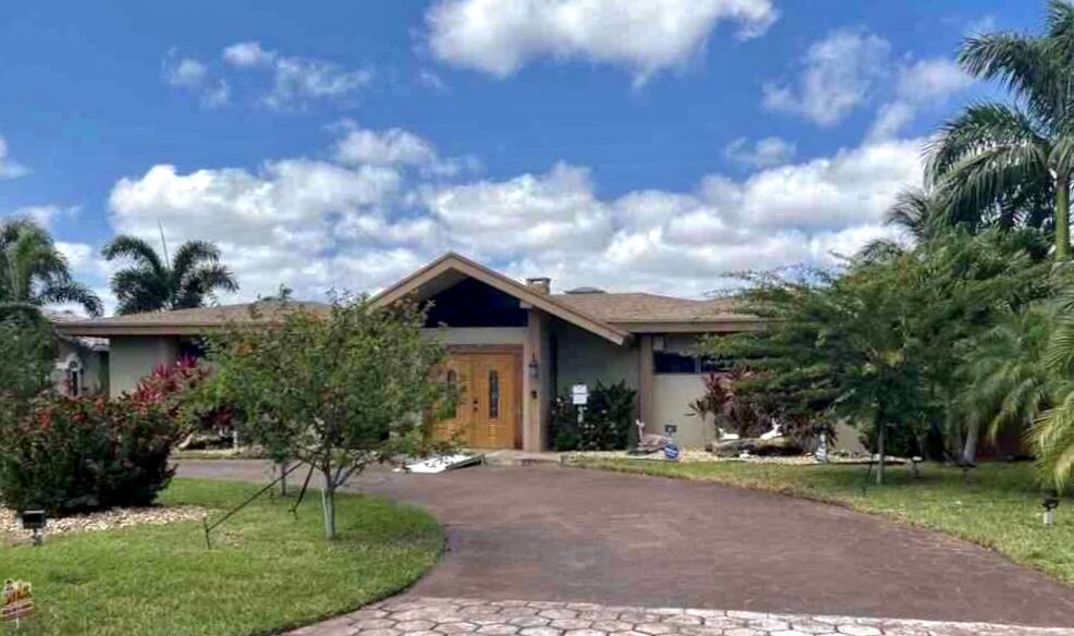 Boater's Paradise!!! Fantastic Waterfront Opportunity Located in Santa Barbara Shores of Pompano Beach. Located on a Wide Part of the Santa Rosa Canal, Just 5 Lots from Intracoastal and Minutes to the Hillsboro Inletwith NO Fixed Bridges! Atlantic Ocean and Beautiful Beaches are just Minutes Away! Enjoy Breathtaking Sunsets From the Unique Position of This Property's Location!This Beautiful Home has 3 Bedroom & 3 Bath Home with 2 Being Master Suites. Bedroom No. 3 currently used as an Office. Kitchen with Cherry Wood Custom Cabinets, Granite Counters and Island with an Expansive Open Floor-Plan with Vaulted Ceilings Throughout, Natural Stone Fireplace and Lagoon Pool with Stone Waterfall and Boat Dock.Make This Waterfront Home Your Own ! ! !