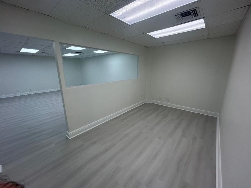 Large newly renovated 5 room office with a kitchen and two entrances available for rent. 1300 sq ft total in an excellent location in Coral Springs. Depending on needs, owners are willing to close off portions of the interior and create a smaller office (price would be adjusted). Electricity, A/C, and access to building's private parking included.