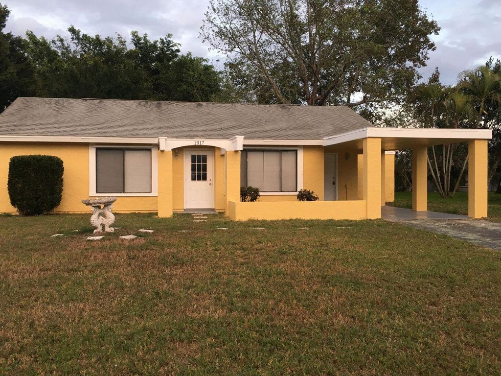 Photo of 1917 SE Burgundy Lane, Port Saint Lucie, FL 34952 (MLS # R10998694)