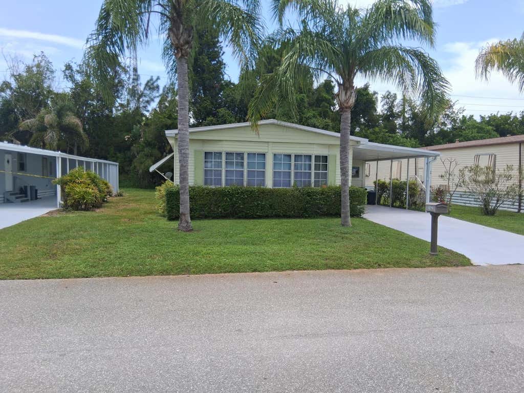 Photo of 214 W Caribbean, Port Saint Lucie, FL 34952 (MLS # B26046214)