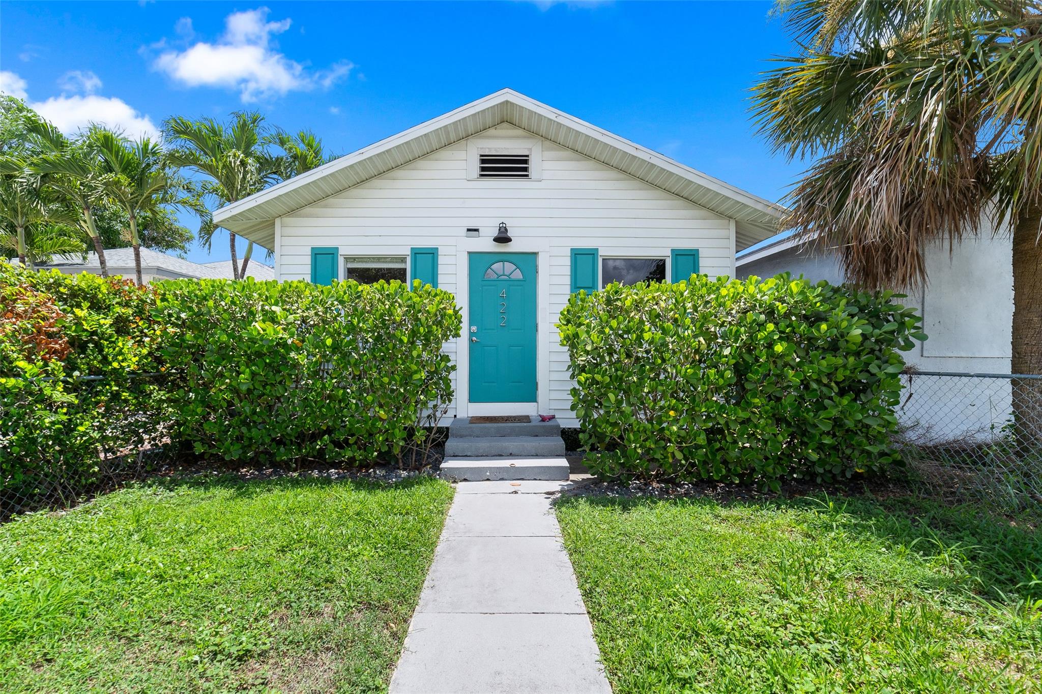 This charming Lake Worth Beach home offers modern comfort and style with updated wood-look vinyl flooring throughout and an open floor plan filled with natural light. The spacious kitchen features stainless steel appliances and in-unit laundry. A cozy fireplace and split-bedroom layout provide both warmth and privacy, with 2 bedrooms and 1 fully updated bathroom. The large, fenced backyard includes a patio and space for a future pool. Additional perks include parking for 2 vehicles and no HOA fees. Located in vibrant Lake Worth Beach, this home is minutes from shopping, dining, parks, and the Intracoastal. Enjoy the energy of a thriving coastal community with historic charm, and cultural attractions. Bundled service pricing available for buyers. Connect with the listing agent for details.
