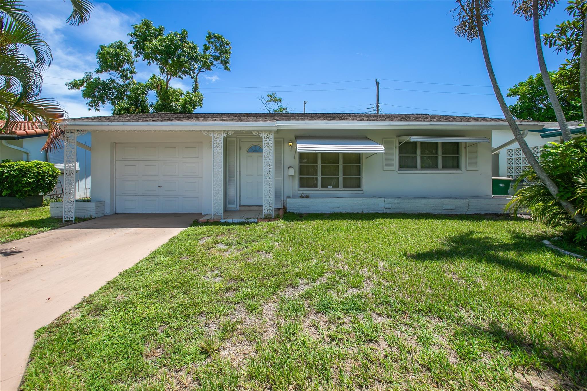 FANTASTIC OPPORTUNITY TO PURCHASE THIS SPACIOUS 2 BEDROOM 1 BATH HOME WITH GARAGE IN TAMARAC* *ALL AGES WELCOME*LOW HOA*TILE FLOORS*FLORIDA ROOM*LAUNDRY ROOM HOME NEEDS UPDATING AND IS PRICED ACCORDINGLY*GREAT LOCATION CLOSE TO MAJOR HIGHWAYS, BEACHES, SHOPPING AND MORE*