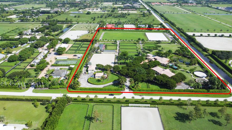 One of a kind stunning Equestrian Estate that makes you feel  like you live in a resort.  Nothing in Wellington compares to this beautiful farm. Set up for POLO, Hunter/jumper and Dressage, this 14.3 acre has 3 barns with 34 stalls, a Grand Prix ring, a Dressage ring with mirrors, a large stick/ ball field for Polo or as a Grand Prix grass ring, and plenty of room for a covered arena . Tons of paddocks with new fencing, main house has 4 bedrooms with an additional 2 bedroom grooms home. Huge pool area  and additional oversized garage for equipment.  This dream farm will not disappoint