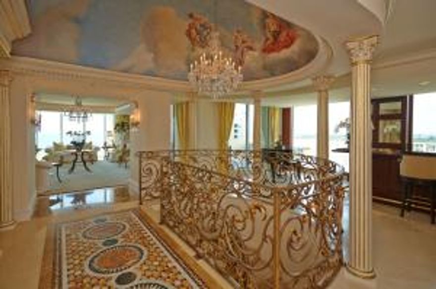 This duplex penthouse combined from four residences totals 11,662 sq ft of panoramic waterfront views. This castle in the sky has the finest details throughout featuring nine balconies with Intracoastal-to-Ocean views.  No detail has been overlooked with 4 bedroom 5 full and 3 half bath, theater room, impact glass windows and doors, high ceilings, Venetian plaster and silk upholstered walls, detailed millwork, metal work and 18 karat gold accents. Property is range priced $6,495,000 unfurnished - $7,100,000 furnished.