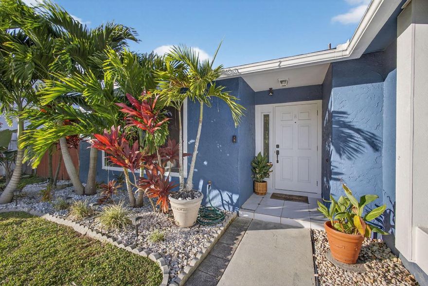 A beautifully updated single-family home in the heart of Jupiter. This gem features spacious bedrooms, renovated master bathroom, and a tastefully upgraded kitchen w/ granite countertops & modern finishes. The open layout is complemented by gleaming white tile floors & cozy electric fireplace. The converted garage offers a versatile space w/ AC and epoxy flooring—perfect as a billiard room, gym, or office. Outside, enjoy a large screened-in porch (10x42)& fenced yard, ideal for relaxing, entertaining, pets & gardening. Add'l features include partial impact glass, a 2023 AC, a 2019 roof, and a washer and dryer. Furniture negotiable.  Don't miss out on this beauty!