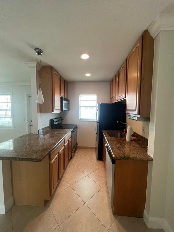 FRESHLY PAINTED*COMPLETELY REDONE GORGEOUS APT*NEW KITCHEN*NEW STAINLESS APPLIANCES*GRANITE COUNTERS*GRANITE BATH*TILE FLOORS THRUOUT*SCREENED & COVERED PATIO*HUGE WALK-IN CLOSET*WASHER & DRYER*ALL NEW DOORS* ALL NEW CROWN MOLDING, BASEBOARDS AND KNOCKDOWN WALLS AND CEILINGS*PRIVACY FRONT SCREEN DOOR WATER INCLUDED*ALL AGES* ONE PET UNDER 20LB *GREAT LOCATION *WALK TO BEACH AND INTRACOASTAL! WILL NOT LAST!