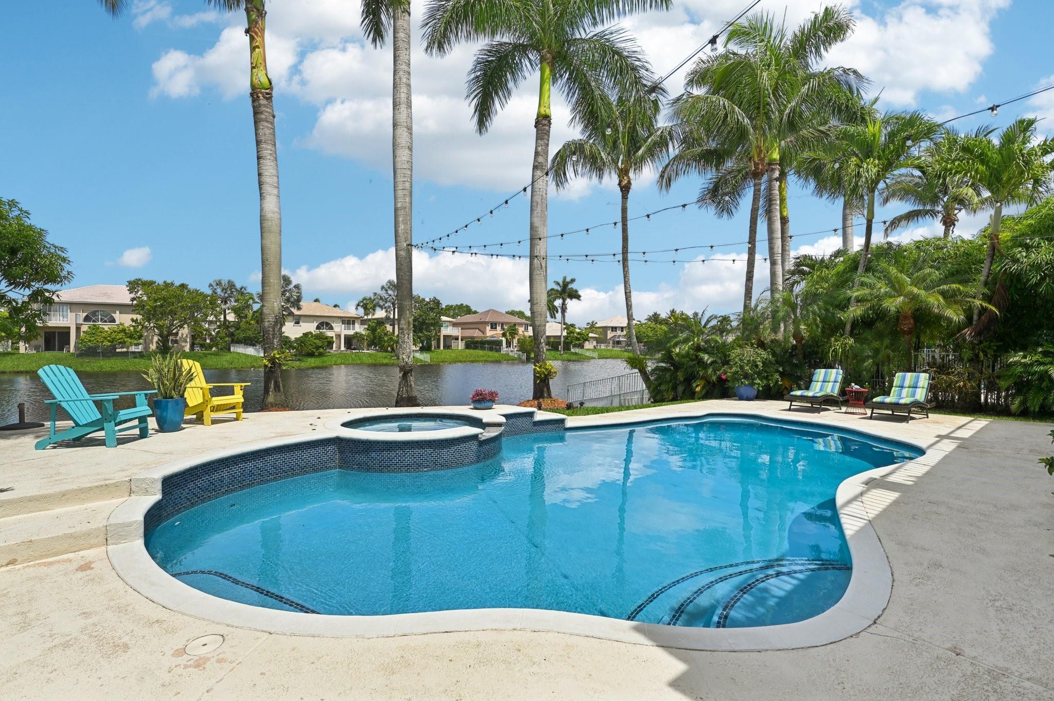 COMING JULY 29. The PERFECT HOME is here! A stunning 6BR/3.5BA waterfront pool home tucked away on a quiet cul-de-sac in guard-gated Pembroke Shores. Enjoy gorgeous lake views from your backyard oasis. Featuring 5 bedrooms upstairs & 1 full bedroom + cabana bath downstairs. The spacious primary suite extends to a balcony running the full length of the house & connects to a 6th BR—ideal as an office, den or nursery. Upgrades include a 2024 roof/gutters, impact windows/doors, newly remodeled kitchen, marble/wood floors, electric shades, renovated pool with new heater/pump/lights, newer A/Cs, 2022 water heater, 2022 landscaping, painted inside and out & more. Immaculate and move-in ready! Top-rated schools! Convenient location to both Fort Lauderdale and Miami (20-30 minutes). Low HOA fees.