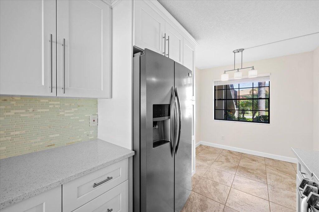 Photo of 101 Pinecrest Circle #A, Jupiter, FL 33458 (MLS # R11105183)