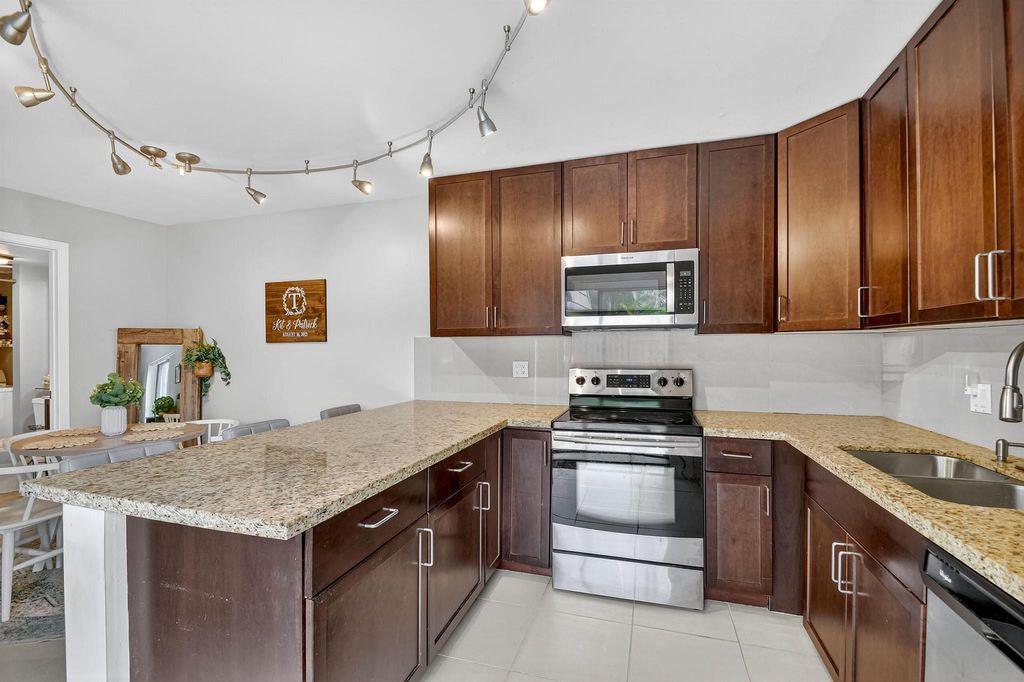 Photo of 1540 Masters Circle #180, Delray Beach, FL 33445 (MLS # R11135377)