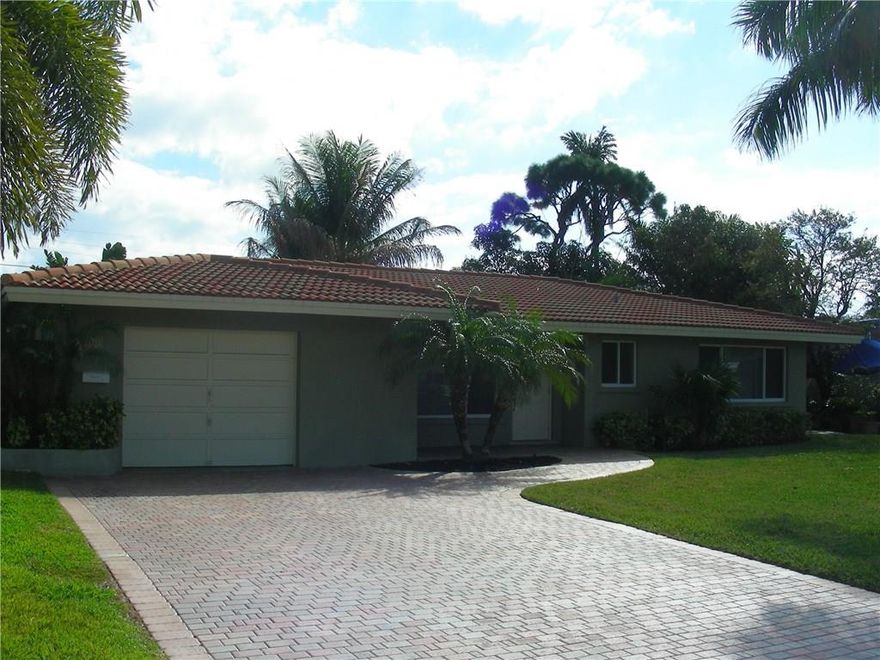 This property is your tropical paradise.  Large 2-bedroom home beautifully remodeled.  Cook in style on granite countertops and stainless steel appliances in your eat-in kitchen.  Both bathrooms have been redone with designer marble and ceramic tiles.  You also have an oversize living area looking out on your backyard pool oasis.  The front and back have been expertly designed with several types of palm trees.  Live as if you are on vacation – rent includes pool and landscaping services.