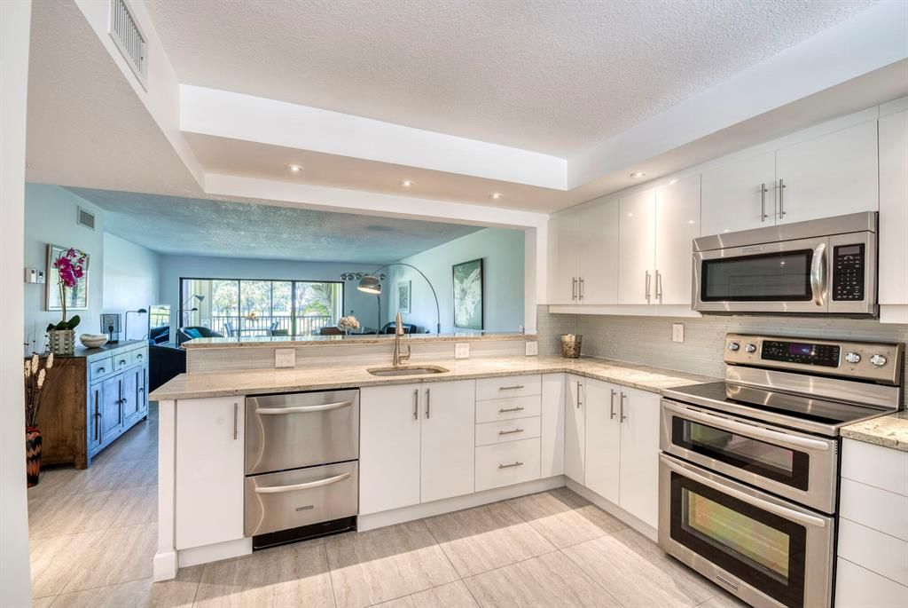 Photo of 12870 Briarlake Drive #201, Palm Beach Gardens, FL 33418 (MLS # R10884199)