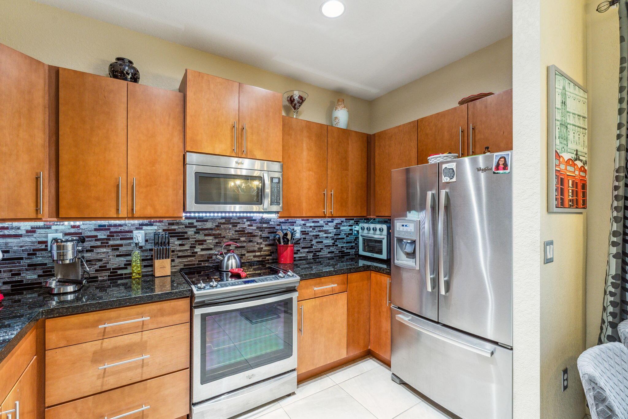 Welcome to your new home in Orchid Grove! This 3-bedroom, 2.5-bathroom townhome, featuring stainless steel appliances in the kitchen and convenient upstairs laundry. Enjoy the elegance of tile flooring downstairs and the warmth of wooden floors upstairs, all without the hassle of carpeting. Residents can relax by the community's sparkling pool or stay active in the fitness center. There is a kids playroom, ensuring fun for little ones. Perfectly situated near shops and beaches, this townhouse offers the ultimate blend of comfort, convenience, and community amenities.