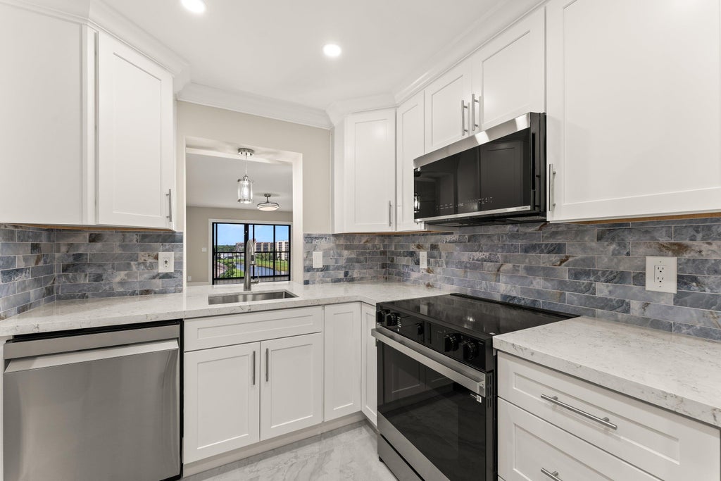 Photo of 14476 Amberly Lane #704, Delray Beach, FL 33446 (MLS # B26051551)