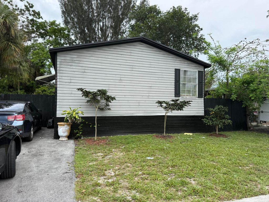 Photo of 10548 W Sandalfoot Blvd, Boca Raton, FL 33428 (MLS # B26035611)