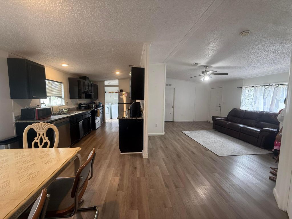 Photo of 10548 W Sandalfoot Blvd, Boca Raton, FL 33428 (MLS # B26035611)