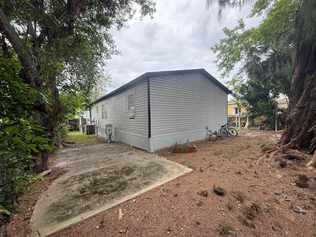 Photo of 10548 W Sandalfoot Blvd, Boca Raton, FL 33428 (MLS # B26035611)