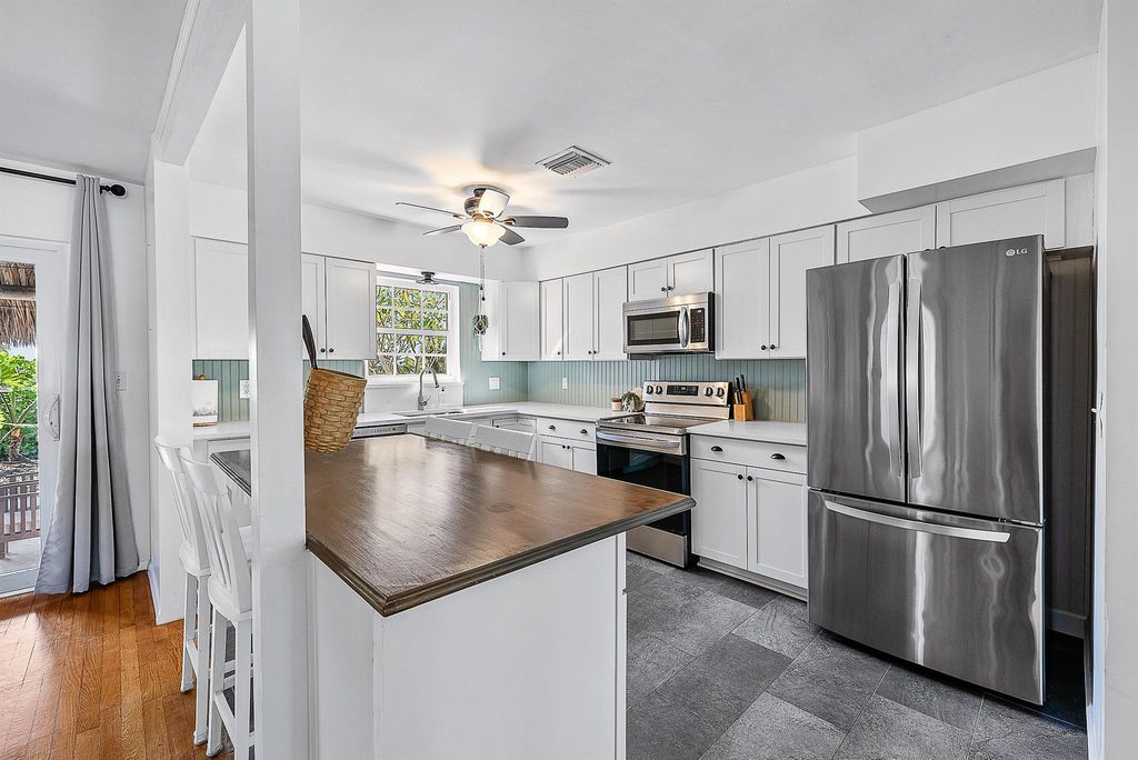 Photo of 381 Zenith Lane, Juno Beach, FL 33408 (MLS # R11049872)