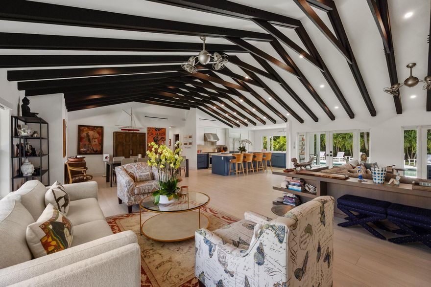 A private oasis awaits you in the premier section of North Palm Beach. This one-story home is in a cul-de-sac and sits on a .37-acre lot with a re-designed oversize pool area and professionally landscaped backyard. A newly constructed gazebo with summer kitchen, outdoor dining, retractable awning and large TV provides an extra 500 sf of covered entertaining space. The inside of the home was completely gutted to the studs and redesigned from ground up with additional living space. Whilst the tax records reflect the year built as 1965, this home lives like a brand new 2025 construction. A substantial amount of the original walls was demolished, the home enlarged and all outside walls are now Concrete Block. The roof structure was modified, reinforced, finished with metal roof and gutters. The open concept living area featuring exposed structural beams is a showstopper. The entire home has been reconfigured and finished to perfection, with no expenses spared. The split plan offers a total of 5 bedrooms; including a completely private master suite with resort-like vibes that leads out to the backyard and pool deck. A full guest suite, complete with kitchen and separate entry, is perfect for visitors or live-in staff. The patio features electric retractable hurricane screens, giving you an option of additional air-conditioned space for outdoor dining. This is a must-see home. Please review the attached Feature Sheet which describes all the improvements in detail. This is hands down the most stunning home in North Palm Beach. Please note that the seller needs a closing after July 24, 2026