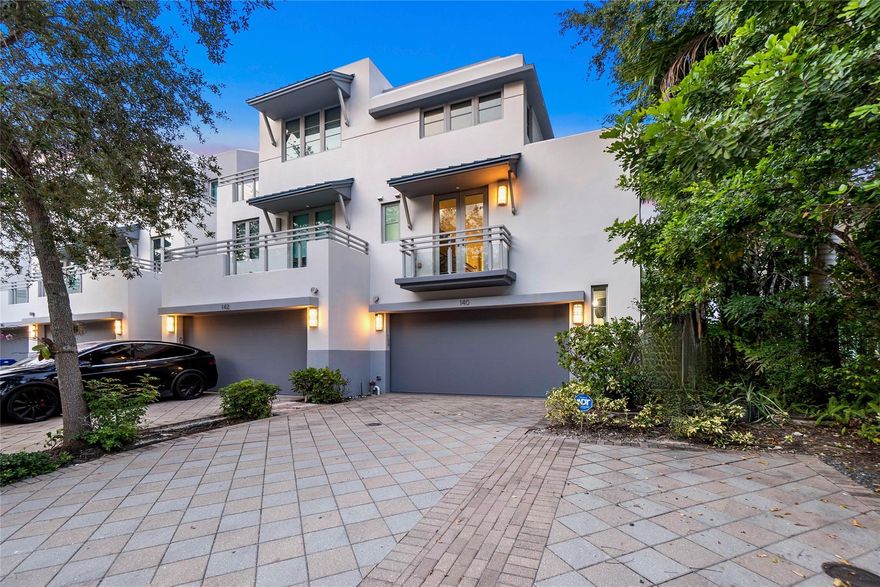 Corner townhouse with boat slip. East exposure, 3 balconies, new remodeled kitchen, stainless appliances, limestone & wood flooring, motorized shades, elevator. Recent  rooftop solar panels reduces energy cost. Wide two car garage. No fixed bridge ocean access.