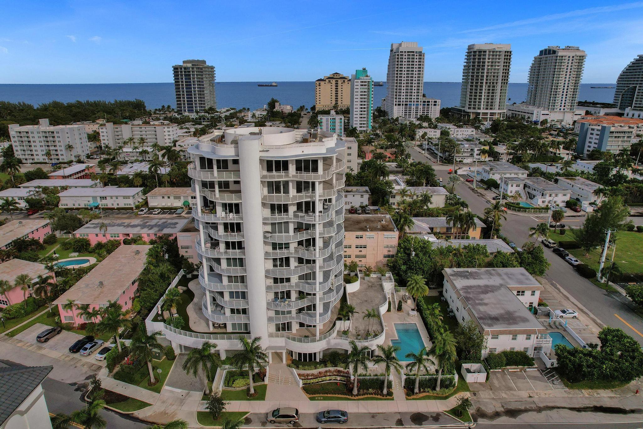 Experience sleek modern living with a touch of mid-century charm in this stunning 3 Bed/ 2.5 Bath Condo just steps from Ft. Lauderdale Beach. Featuring floor to ceiling impact windows, clean lines, and an open concept design, this residence boasts sweeping ocean and intracoastal views from every room. The highlight is the expansive wraparound terrace, offering maximum outdoor living space for dining, entertaining, or simply soaking up the coastal lifestyle. A true blend of timeless style and contemporary luxury by the beach. Total 3,105 sq. ft. indoor/outdoor space. Residents enjoy access to a resort-style heated pool, outdoor dining & lounge area, outdoor barbecue grill, fitness center and concierge services. 2 car garage parking included, pet friendly.