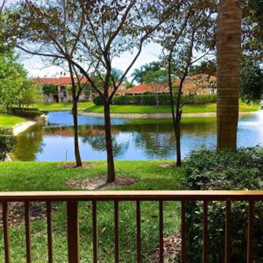 Charming 1st Floor Direct Lakefront view with eastern exposure to capture Tropical Breezes.  Neutral Colors throughout.In move in condition.  Great gated security and fabulous resort style recreation amenities.  You can't go wrong with this apartment.