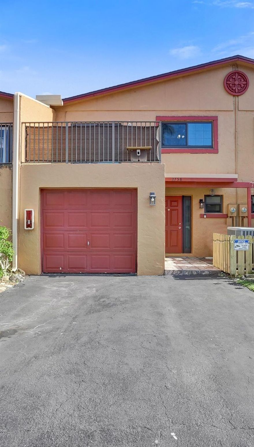 This updated & spacious 3 bedroom, 2 & a half bath townhome with a garage & double driveway can't be missed! The roof was just replaced in 2021 & the AC, washer & dryer and stainless steel appliances are all newer as well. There is tile throughout on the main level & all new water resistant luxury vinyl plank flooring has been updated on the stairs and throughout the 2nd level! The bathrooms have been updated as well & fresh paint throughout! In addition to these updates, ALL of the the windows & sliders are hurricane impact windows! There is ample outdoor space to enjoy with 2 covered & screened patios upstairs & downstairs & an open balcony in the front, so you can sit out and watch the gorgeous FL sunrises in the back & the sunsets in the front! There is also a fenced in backyard space