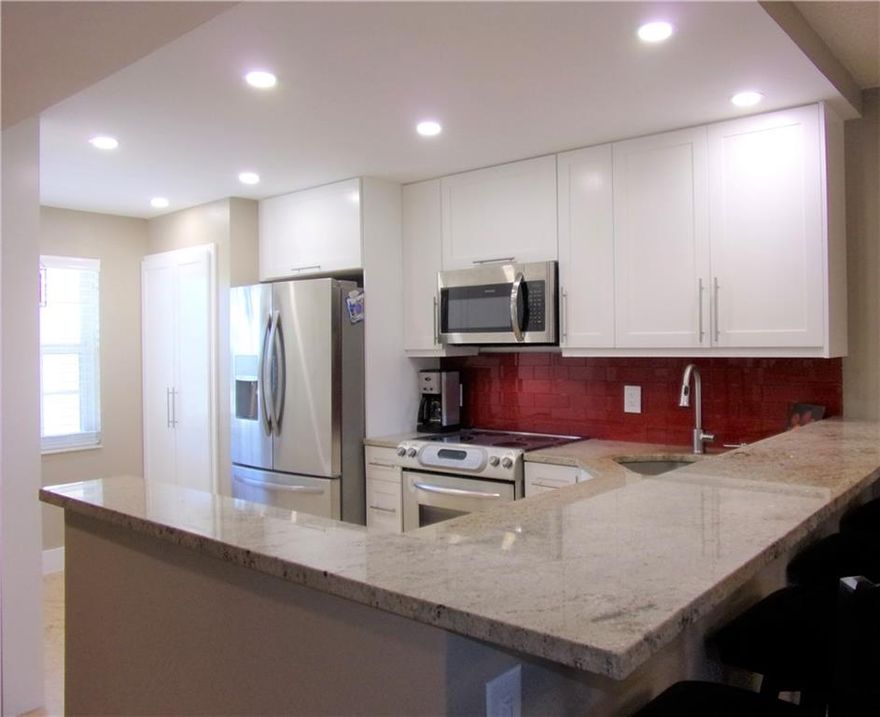 Freshly remodeled with all impact windows including the slider. This professionally decorated unit looks like it is out of the pages or Architectural Digest. The open kitchen with extra large pantry is bright and creates a space that connects you to your guests as you work in the kitchen. The stacked washer and dryer are extra capacity and new along with all the other appliances. The second bedroom/den, is being used as a tv room and has a stylish murphy bed on the back wall. The master bedroom has a walk-in and wall closet. The wall closet is currently being used as a home office and the owner will convert back to a closet if you desire. Both bathrooms have been totally remodeled with walk-in showers. The building is right across the street from the pool and steps to Oaks Clubhouse. Freshly remodeled with all impact windows including the slider. This professionally decorated unit looks like it is out of the pages or Architectural Digest. The open kitchen with extra large pantry is bright and creates a space that connects you to your guests as you work in the kitchen. The stacked washer and dryer are extra capacity and new along with all the other appliances. The second bedroom/den, is being used as a tv room and has a stylish murphy bed on the back wall. The master bedroom has a walk-in and wall closet. The wall closet is currently being used as a home office and the owner will convert back to a closet if you desire. Both bathrooms have been totally remodeled with walk-in showers. The building is right across the street from the pool and steps to Oaks Clubhouse.