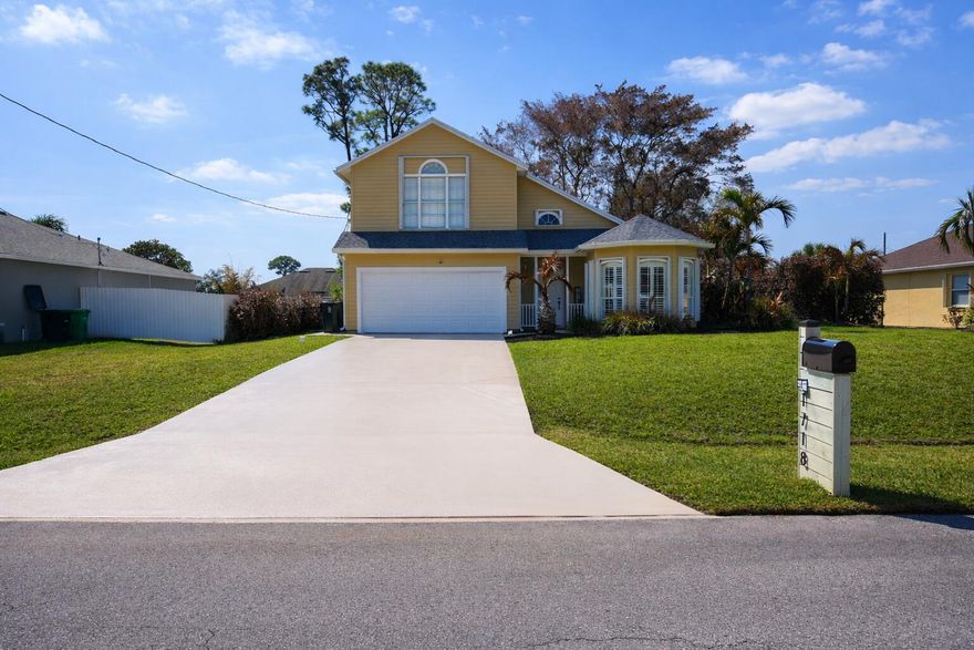 Beautifully updated pool home in the heart of Port St. Lucie! This spacious 3-bedroom, 2.5-bath residence showcases quality upgrades and stylish finishes throughout. The designer kitchen is a true standout, featuring rich wood cabinetry, a custom tile backsplash, granite countertops, and top-of-the-line appliances. Additional enhancements include updated ceiling fans and light fixtures, upgraded bathroom mirrors and hardware, and elegant plantation shutters throughout the home. Step outside to your extended patio and private pool area, perfect for relaxing or entertaining. Accordion shutters provide added hurricane protection and peace of mind. Plus, the home is equipped with solar panels, helping you enjoy impressively low monthly electric bills and energy savings. Roof installed 2023. This move-in-ready home combines comfort, style, and efficiency, all in a prime Port St. Lucie location.