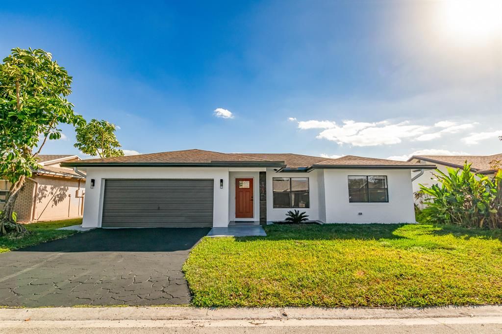 Photo of 9630 NW 83rd Street St, Tamarac, FL 33321 (MLS # R10689502)