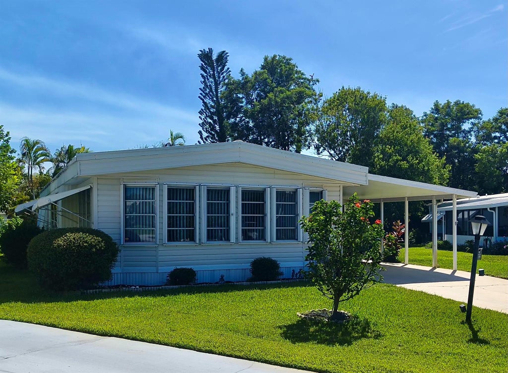 Photo of 85 S Warner Drive, Jensen Beach, FL 34957 (MLS # R11110592)