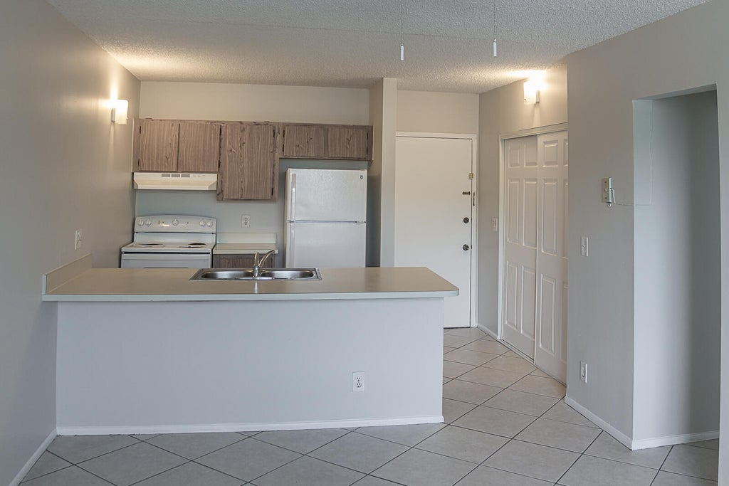 Photo of 2501 RIVERSIDE Drive #209-A, Coral Springs, FL 33065 (MLS # B26085034)