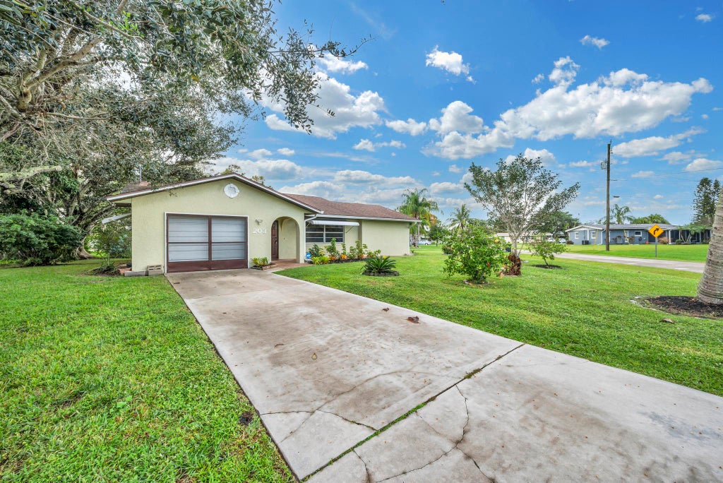 Photo of 203 SE Camino Street, Port Saint Lucie, FL 34952 (MLS # R11097774)