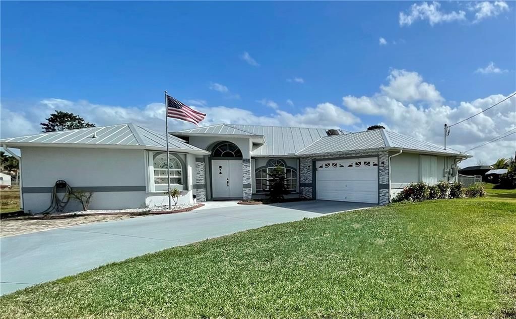 Photo of 1402 SW Hackensack Ave, Port Saint Lucie, FL 34953 (MLS # F10319379)